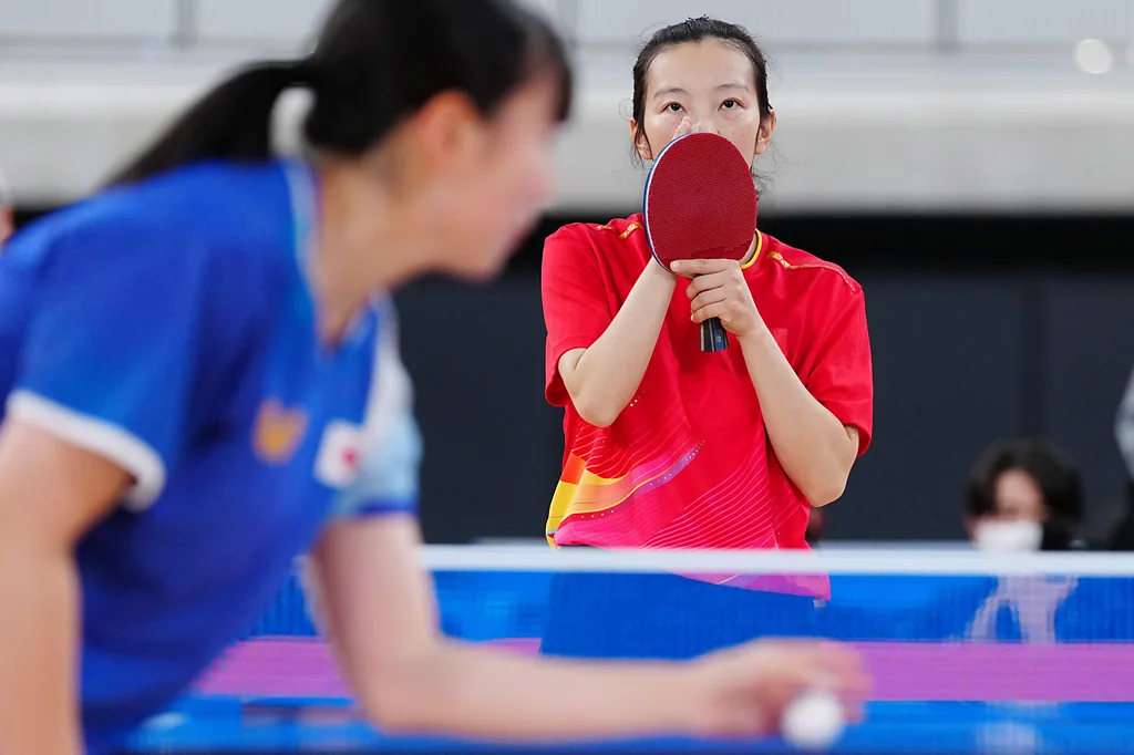 Table tennis match at the Tokyo Deaflympics using visual technology for deaf spectators.