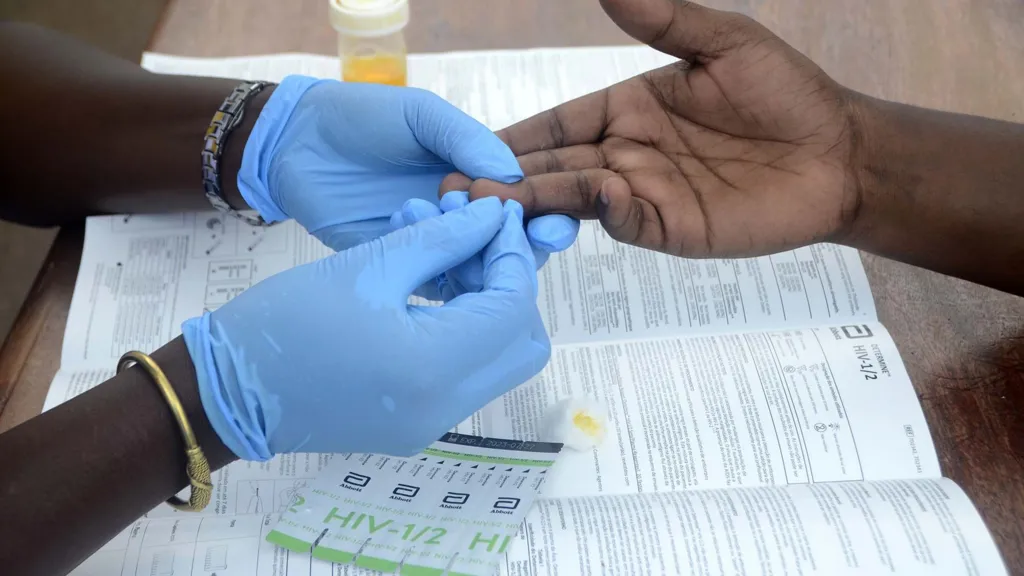 Medical worker taking blood samples during HIV testing programme in Zimbabwe