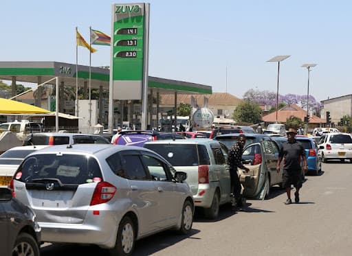 Motorists queue at a Harare fuel station as Zimbabwe fuel taxes cut plans and E20 blending are debated